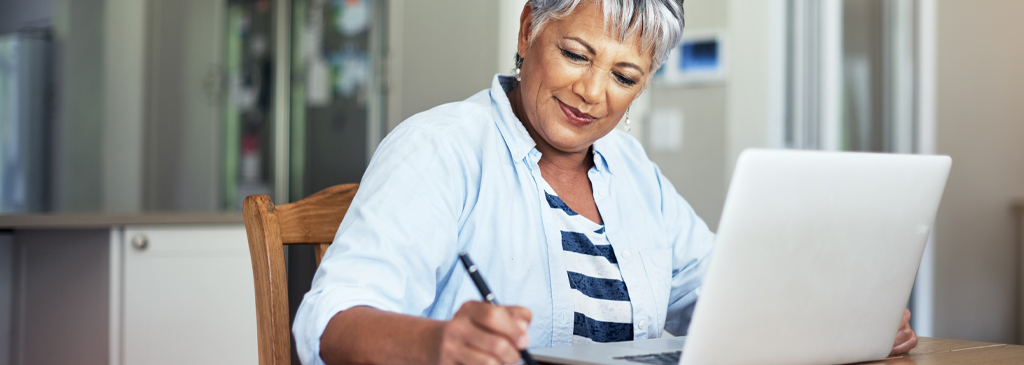 Mature female student doing her course work.